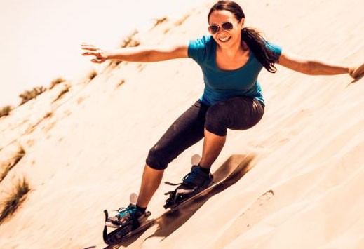 Sandboarding in Dubai desert