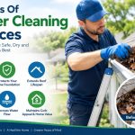 Professional technician cleaning roof gutters to prevent water damage and protect a residential home.