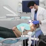 Professional dentist providing orthodontic care to a patient.