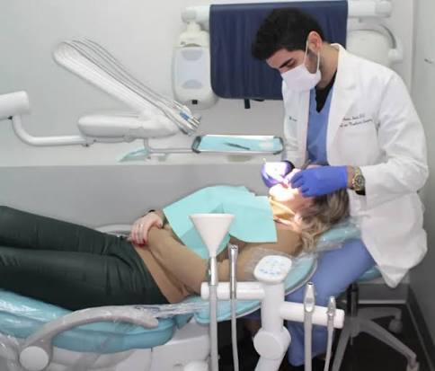 Professional dentist providing orthodontic care to a patient.